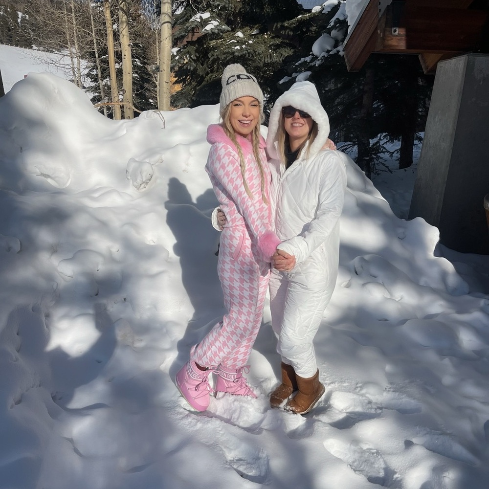 Pink and white snowsuit